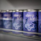 A row of sleep toniq cans in the fridge